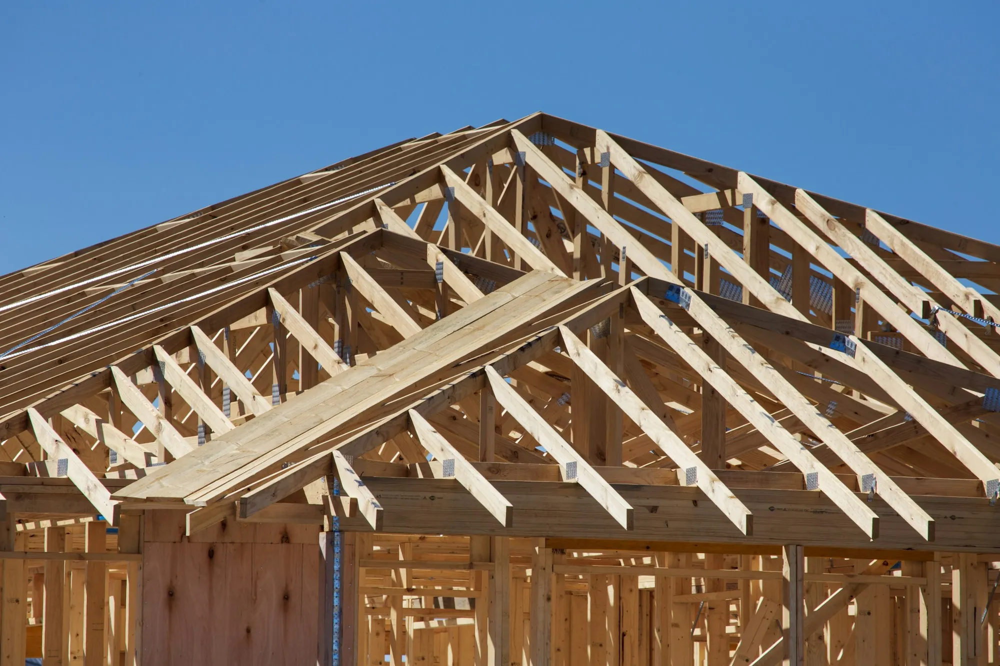 Wood roof framing going up on a house